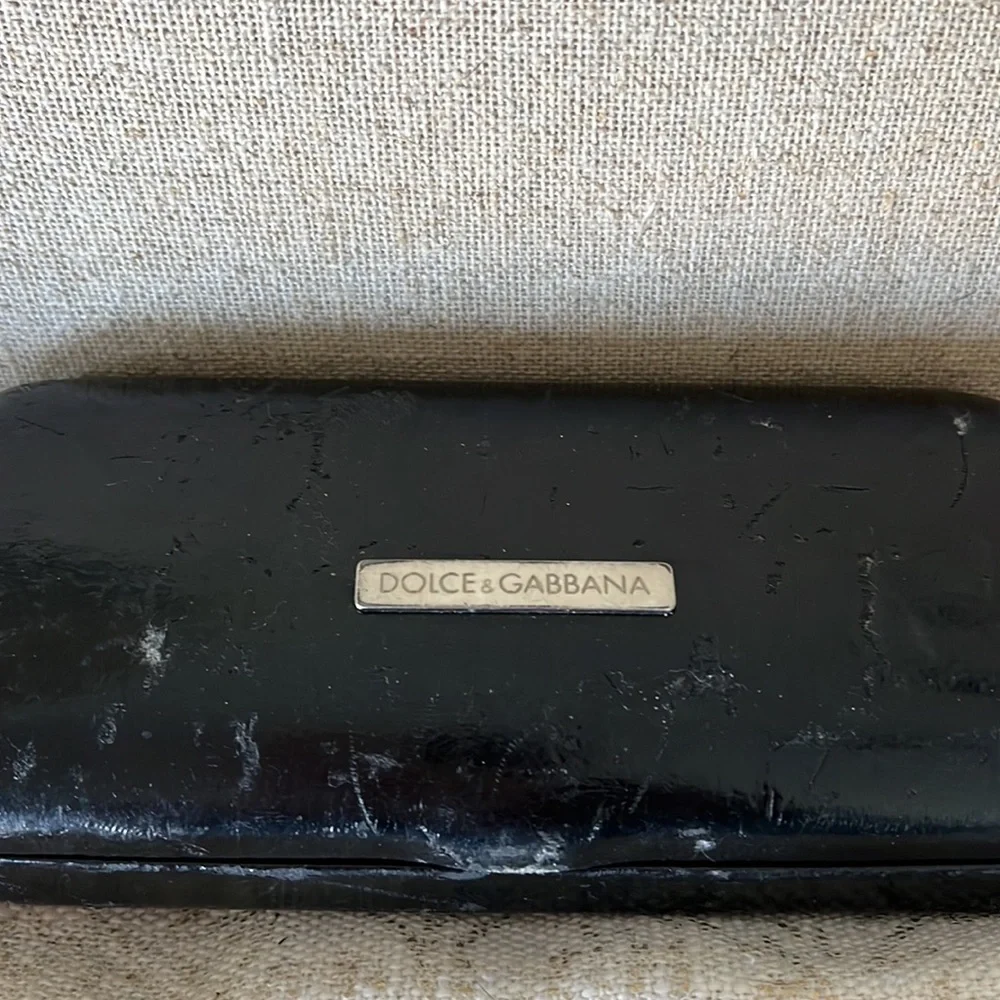 - Dolce and Gabbana black wire frame glasses